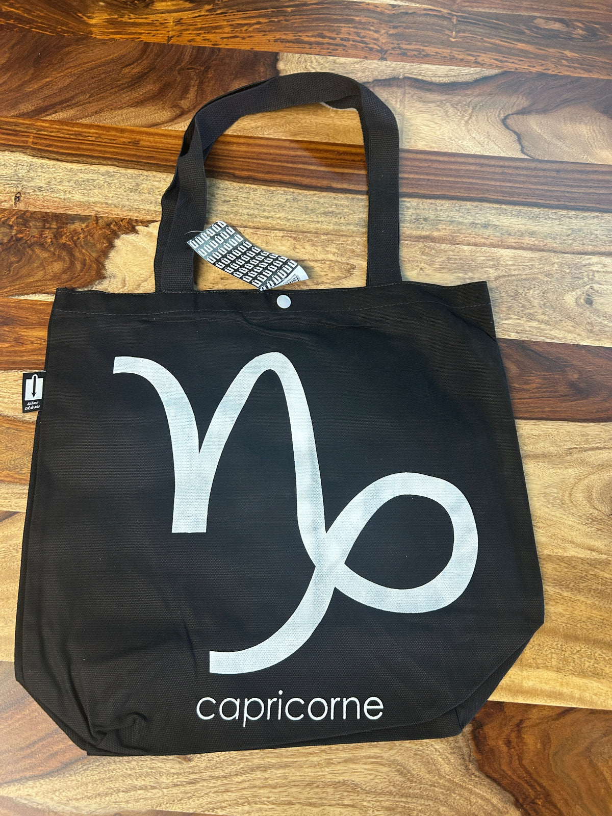 Tote bag noir au symbole du Capricorne imprimé en blanc