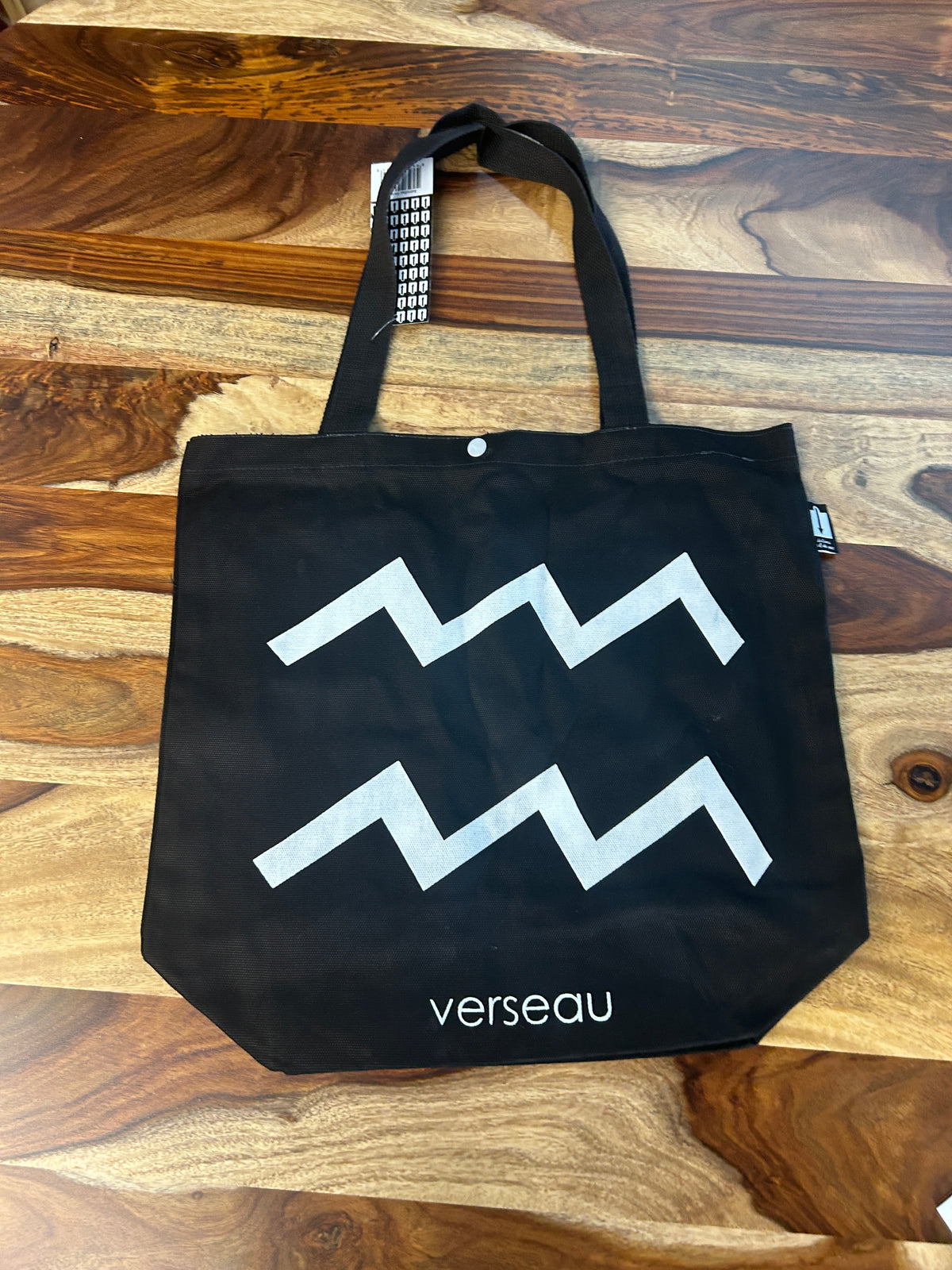 Tote bag noir au symbole du Verseau imprimé en blanc