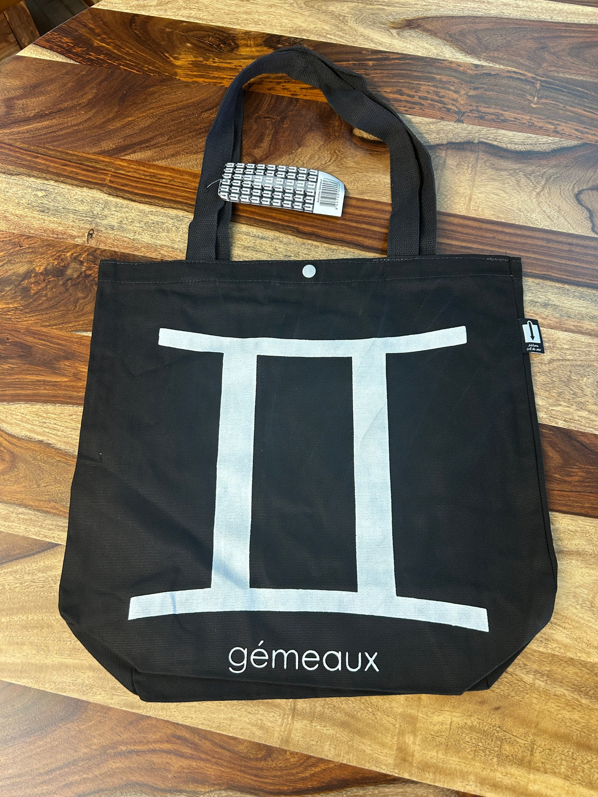 Tote bag noir au symbole des Gémeaux imprimé en blanc