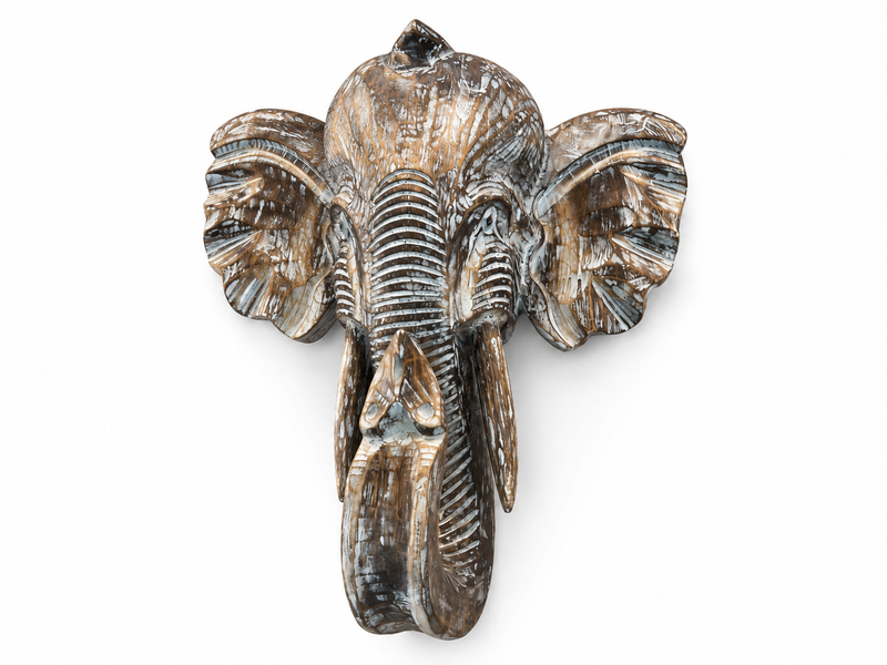 Tête d'éléphant en bois sculpté vue de face, oreilles déployées et trompe pendante